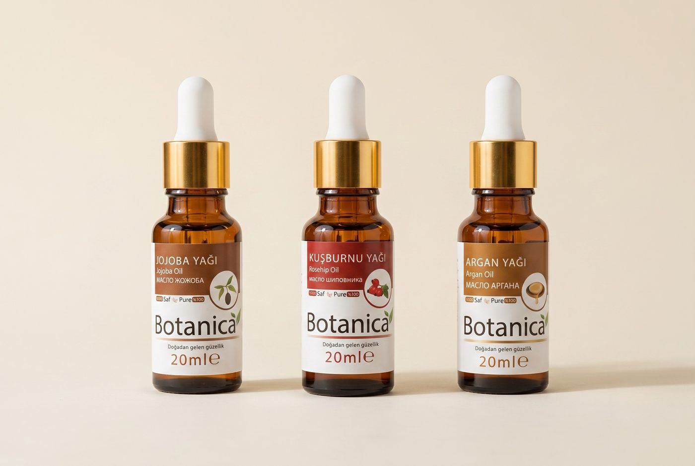 Botanica jojoba, kuşburnu ve argan yağları amber cam şişelerde